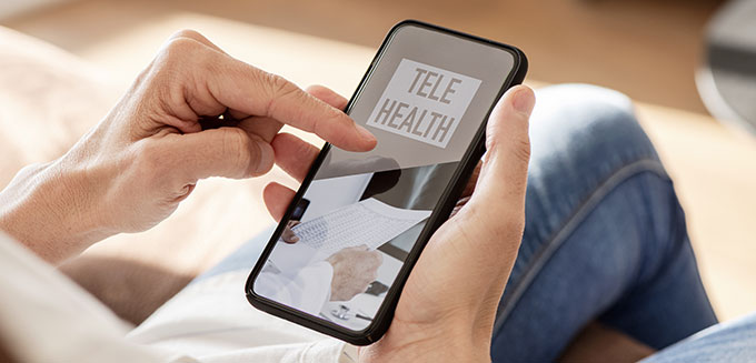 Person using telehealth service on their cell phone