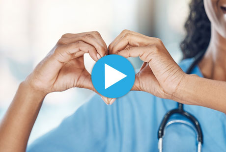 Nurse making a heart shape with her hands